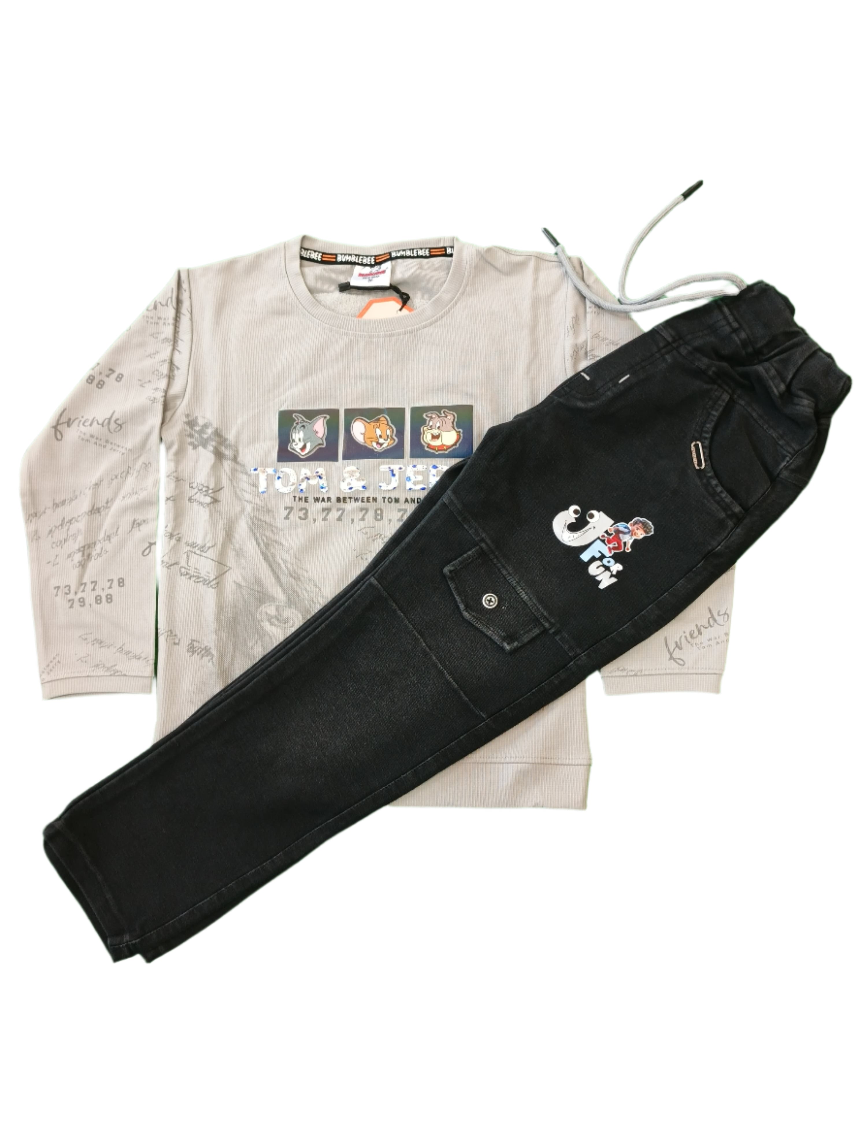 Black pants and beige apron with cartoon character design on a green background