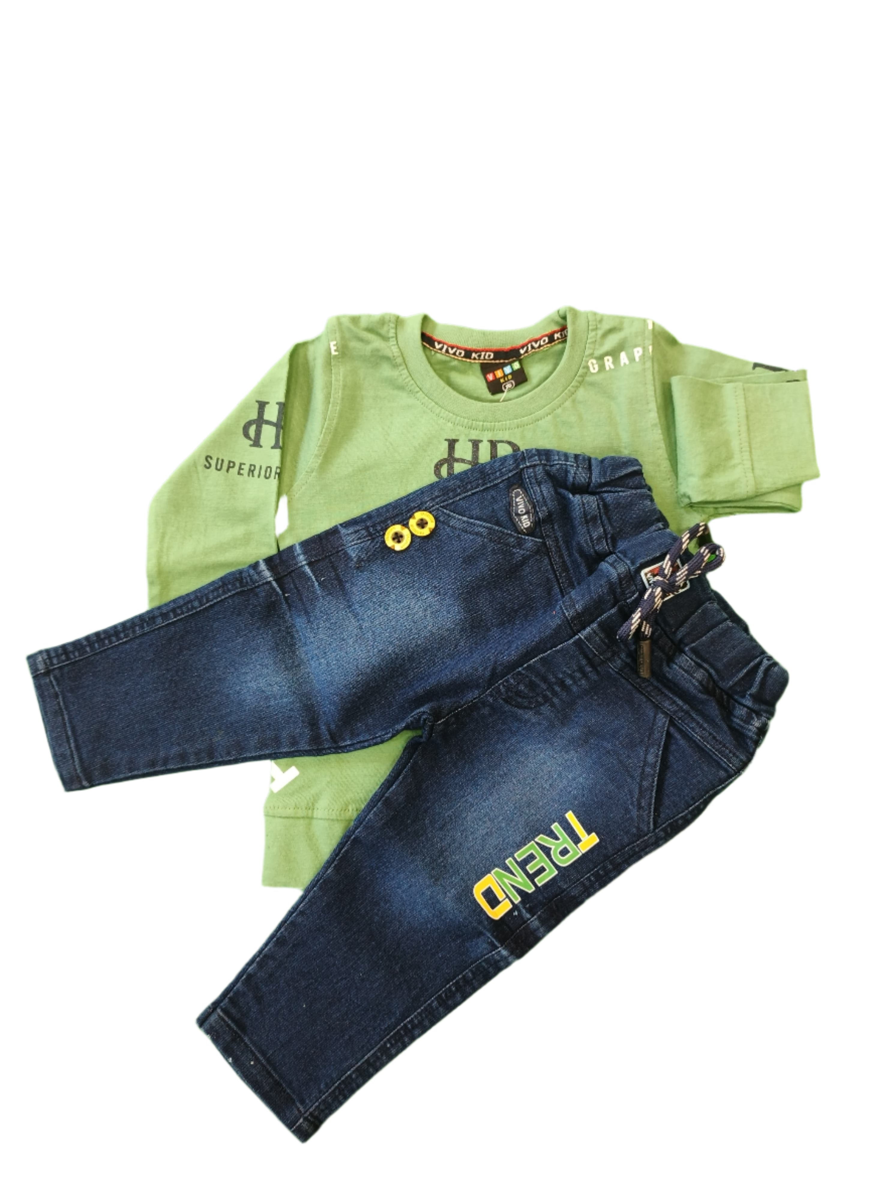 Children's jeans and shirt on a green background