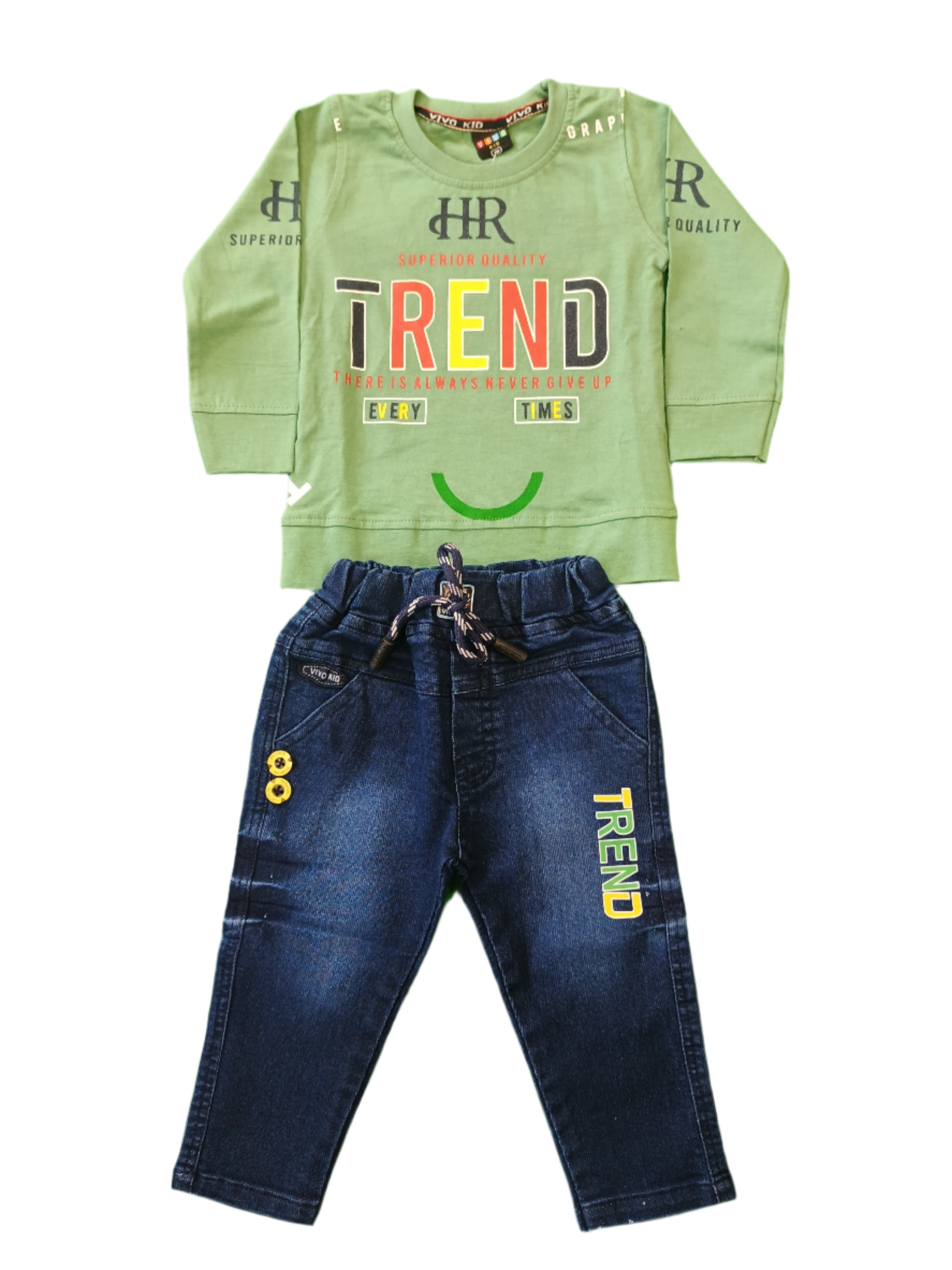 Children's outfit with green long-sleeve shirt and blue jeans on a green background