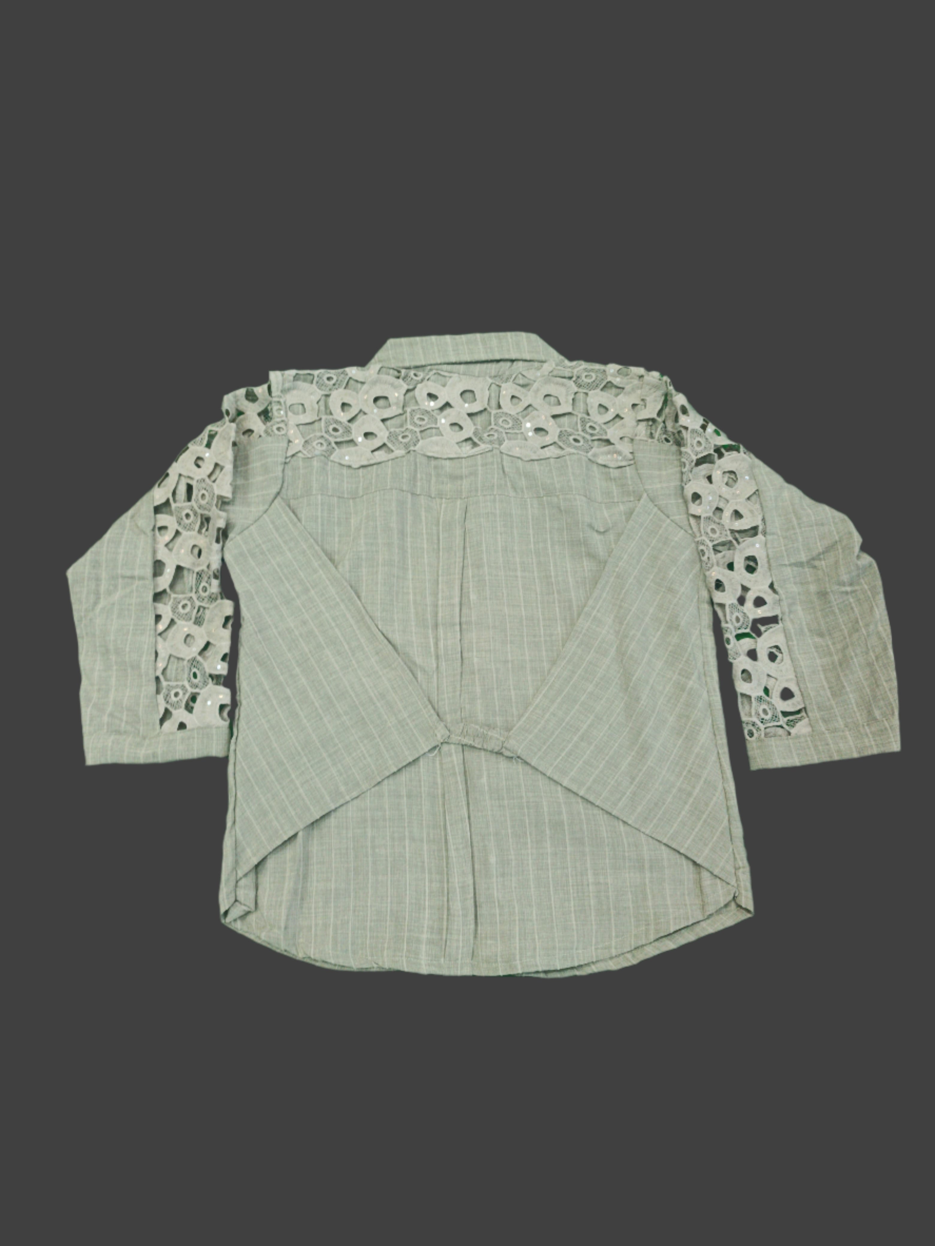 Green fabric with floral lace trim on a green background