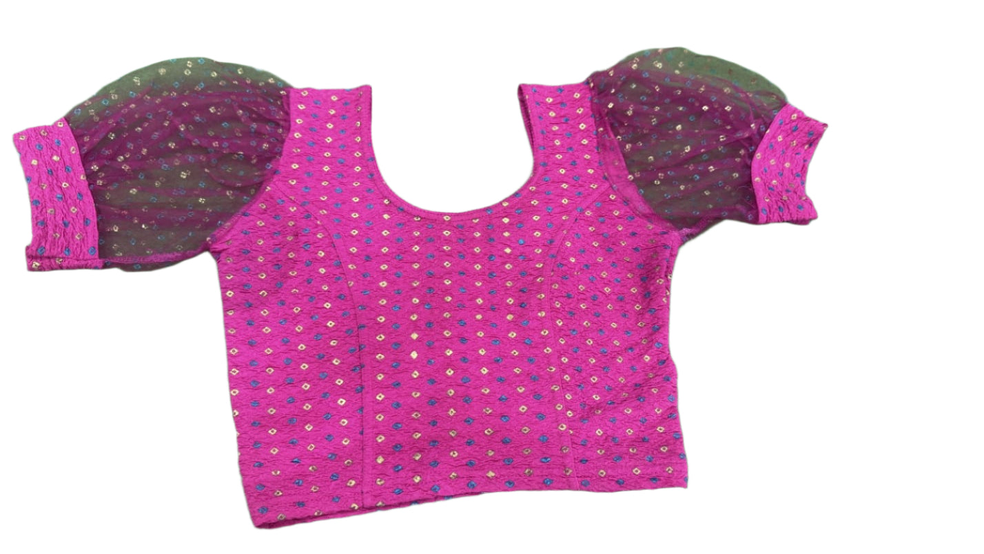 Pink fabric with cut-out patterns on a green background