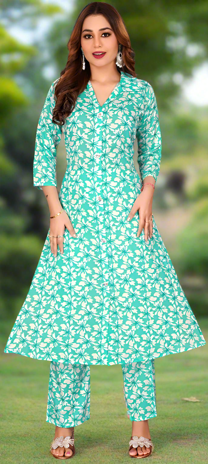 Woman wearing a green floral outfit with a blurred green background