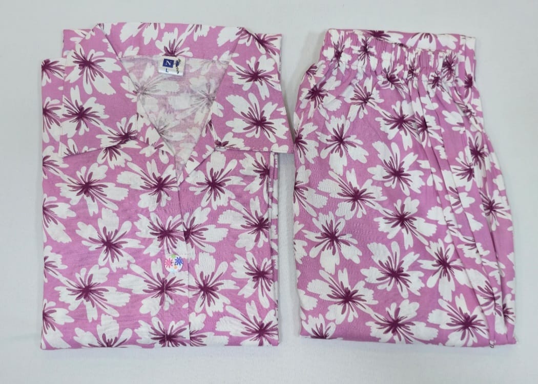 Pink floral pajama set on a white background