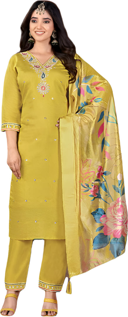 Woman wearing a yellow traditional outfit with floral dupatta on a black background