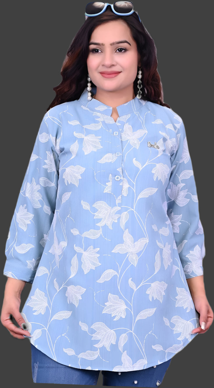 Woman wearing a light blue floral print shirt against a black background