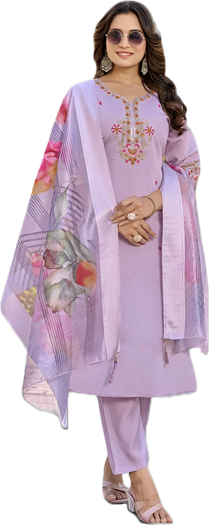 Woman wearing a light purple embroidered outfit with a floral dupatta on a black background